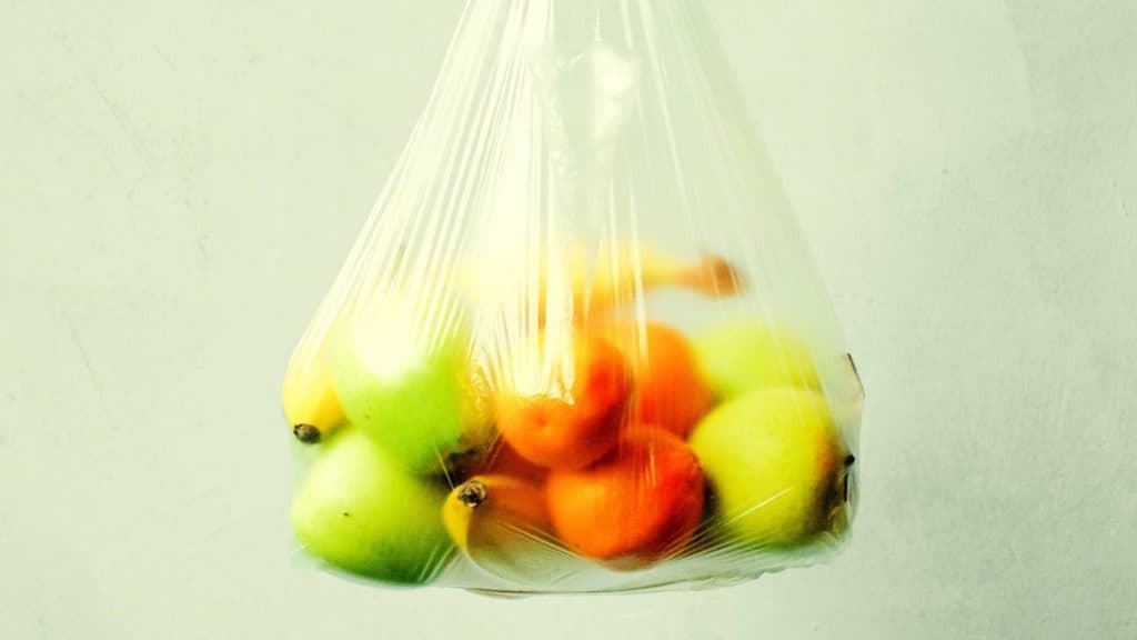 Fruits with peels on in unnecessary plasti bag